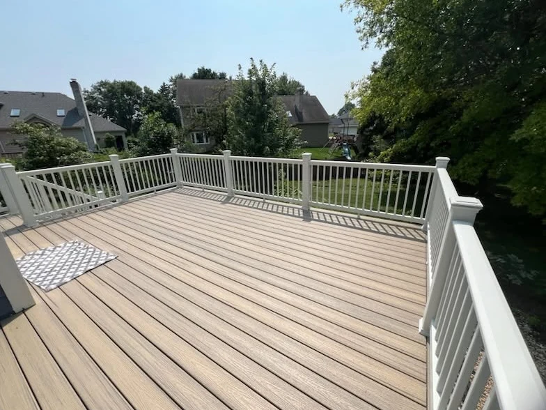 Tan deck surface enclosed by white railings