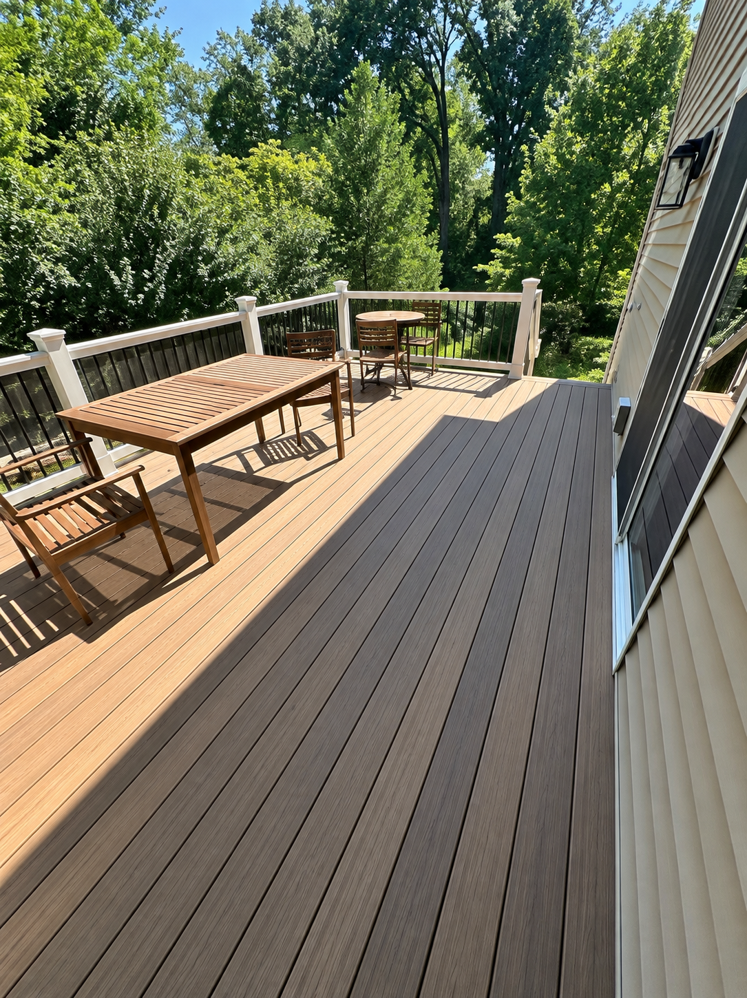 Two-tone deck arranged with an outdoor dining table