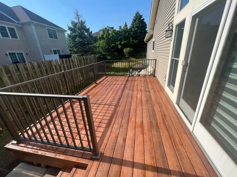 Wood deck boards beside black railing