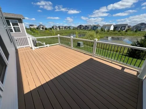 Composite deck with contrasting border and railing