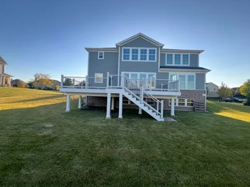 Raised deck and stairs at the back of a home